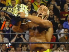 Hogan Shows The Belt To The Fans